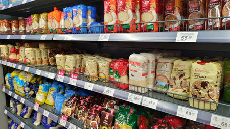 Dnipro, Ukraine - April 09, 2025: Diverse assortment of rice packages on supermarket shelves....