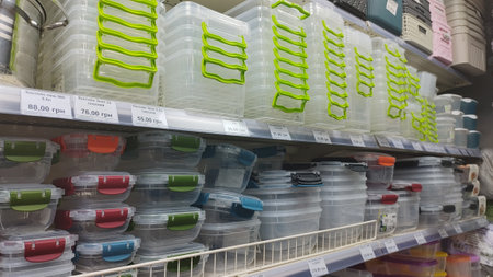 Dnipro, Ukraine - April 26, 2025 - Variety of stackable plastic containers on store shelf for...