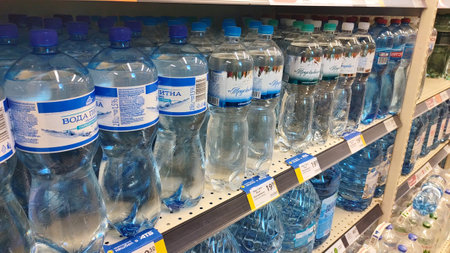 Dnipro, Ukraine - April 26, 2025 - Bottles of mineral and drinking water displayed on supermarket...