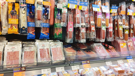 Dnipro, Ukraine - April 26, 2025 - Assortment of cured and smoked sausages and sliced deli meats...