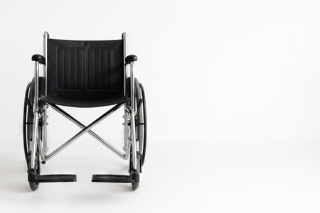 Front view of medical wheelchair on white background. concept of healthcare, mobility aid, disability support, medical equipment, independence, accessibility, copy space, white background.の写真素材
