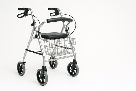 Aluminum rollator walker featuring adjustable handle and comfortable seat for improved mobility. concept of independence, elderly care, accessibility, copy space, white background.の写真素材