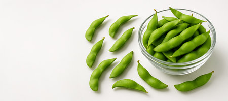 Fresh edamame displayed simple on white background. concept of healthy snack, plant-based diet, nutritional food.の写真素材