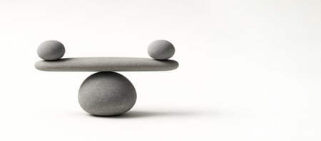 Stones balancing in minimalist zen arrangement symbolizing harmony and meditation on white background. concept of balance, serenity, natural art, meditative focus, copy space.の写真素材