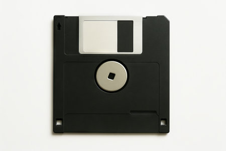 Black floppy disk isolated on white background representing vintage technology and retro computing...