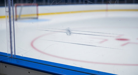 Ice hockey rink with scratched plexiglass boards and goal on winter sports arena. concept of...