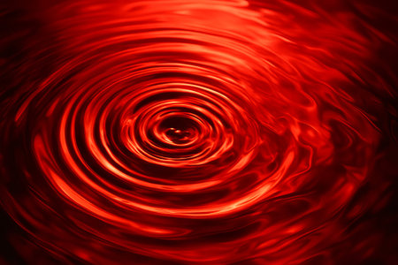 Red water ripples texture background creating an abstract pattern. Vibrant liquid surface with circular waves for dynamic visual effect.の写真素材