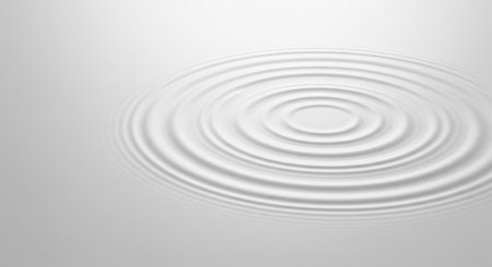 Trendy white color 2026 year. White ripple circle on a liquid surface. Abstract background of smooth pure liquid splash or wave for cosmetic cream, milk or yogurt product design..の写真素材