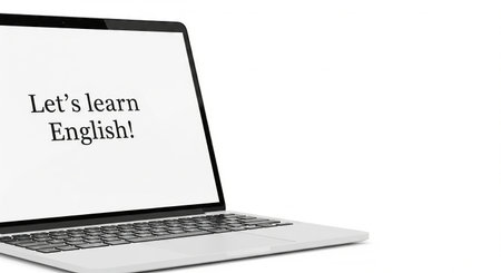 Laptop screen displaying lets learn English text. Online education and language learning concept for foreign language study. copy space.の写真素材