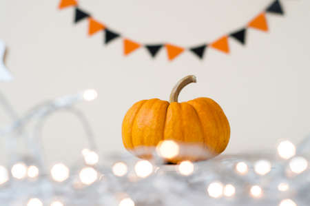 Halloween pumpkin with candlelight and bokeh background.の写真素材