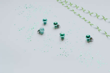 On a light background, New Year's elements for decoration, summer and Christmas balls, space for...