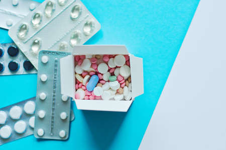 Box of medicine as a pharmacy delivery. Online shopping and medicine delivery concept. Capsules,...