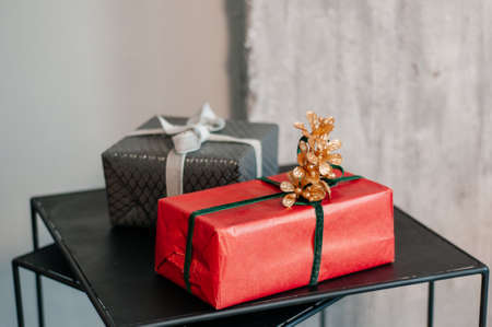 packing of New Years gifts. family holidays celebration concept. paper packaging for gifts.の写真素材