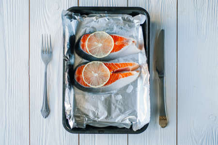 red fish dishes, healthy nutrition concept. Fish baked in foil.の写真素材