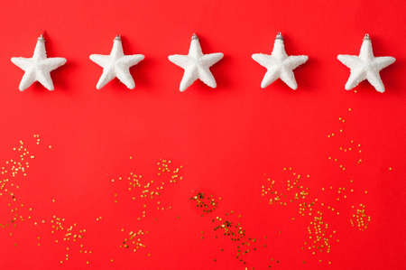 Christmas composition. White decorations on a red background. Christmas, winter, new year concept. top view, copy space.の写真素材