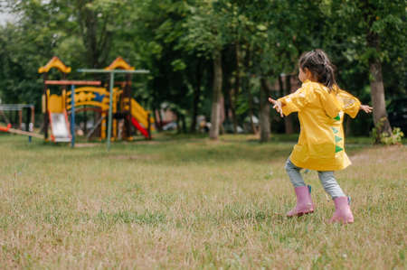 a girl of 4-5 years old shows different emotions. yellow clothes.