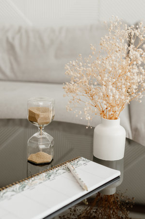 workspace, table for working with an hourglassの写真素材