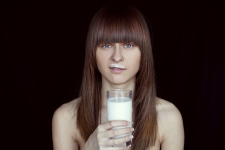 girl with glass of milk の写真素材