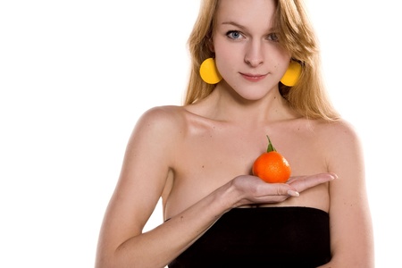 Portrait of beautiful woman with orangeの写真素材