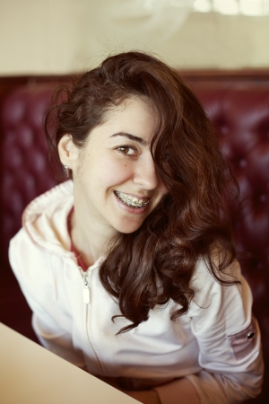 Portrait of young woman with brackets の写真素材