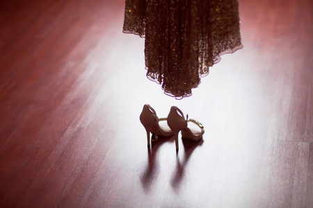 silver shoes and wedding dressの写真素材