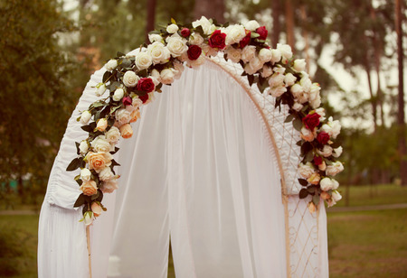 Wedding Arch with flowers on the grassの写真素材