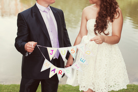  bride and groom in wedding day in the parkの写真素材