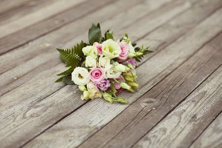 white and pink wedding bouquet in parkの写真素材