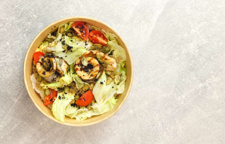 Salad with fish. Fresh vegetable salad with baked fish fillet. Fish salad with fried fillet and...