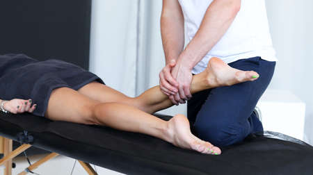 Anti cellulite massage for young woman in beauty salon. Perfect skin fat burning beauty concept.の写真素材