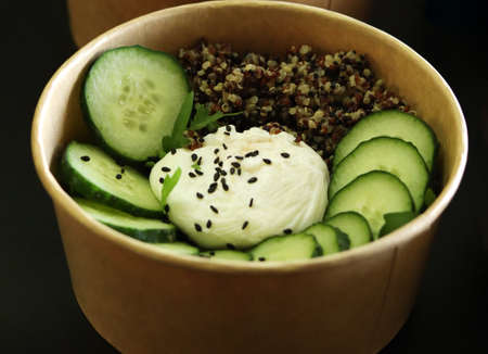 Healthy food and diet concept. food delivery. Lunch boxes with food. Bowl with poached egg, quinoa...