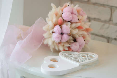 Bouquet of cotton flowers on a white table in the roomの写真素材