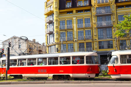 Kyiv, Ukraine - August 30, 2019: Red retro tram on Nyzhnii Val street - Podil district. Red tram is a popular tourist transport and attraction.のeditorial素材