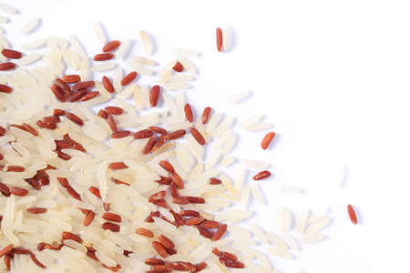 Two mixed of rice varieties isolated on a white background: red rice and white (jasmine) rice.