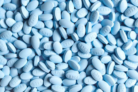 Blue pills as background, closeup. Health care and medical concept