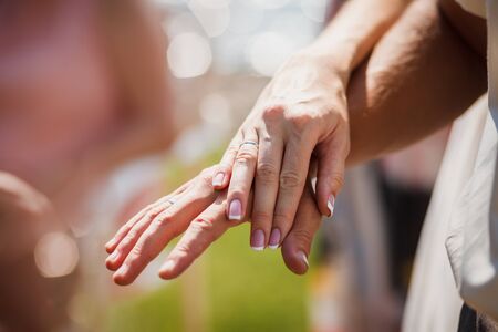 Wedding couple hands gently touching. Close up.