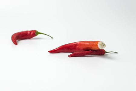 ugly red chili pepper with mold on white background flat lay , top viewの写真素材