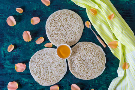 traditional Moroccan pancakes baghrir on dark green wooden background , top view , flat layの写真素材