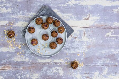 Oatmeal balls , Oats dates and cranberries energy balls, selective focus , top view , flatlay with copy spaceの写真素材