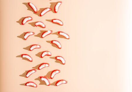 Halloween jello teeth candies or gummies on apricot background, flat lay with copy spaceの写真素材