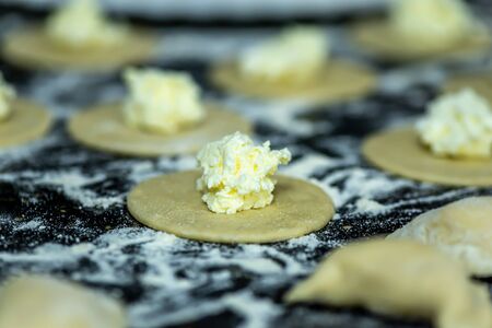 Raw dumplings or vareniks, traditional Russian and Ukrainian food, close upの写真素材