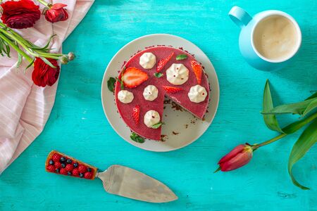 Vegan raw cake made of strawberry and banana cream, with almond base, gluten free, vegan food concept, top view, flat layの写真素材