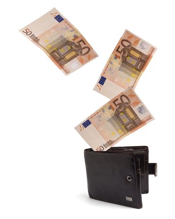 Open purse in which money for a white background fallsの写真素材