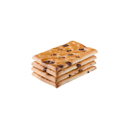 A heap of chocolate chip cookies on a white backgroundの写真素材