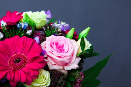 Beautiful bouquet with color roses and gerberas, astras, daisy.
