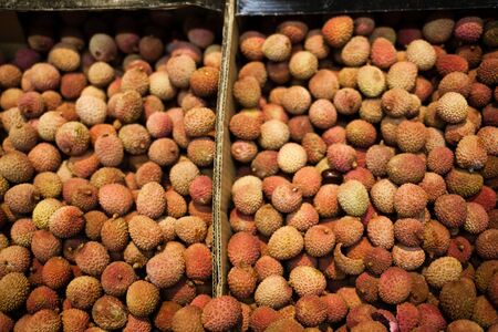 Lychee, litchi, lichi on market for fruit pattern background. Healthy and vegetarian food.の写真素材