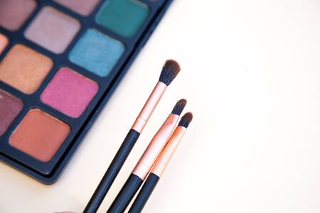 Palette of colorful make up eye shadow and brushes.の写真素材