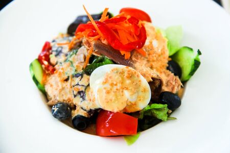 Nicoise tuna and anchovies salad with vegetables and eggs.の写真素材