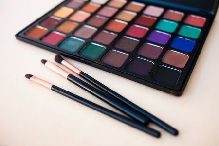 Palette of colorful make up eye shadow and brush.の写真素材