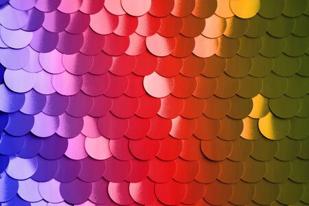 Abstract background with large round shiny sequins. Color backdrop. Modern art concept.